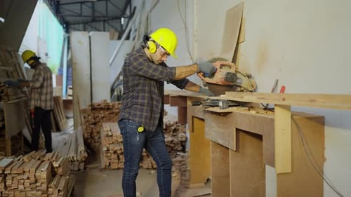 Two Men Working with Wood in Workshop