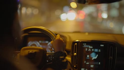 Driving in City at Night During Rain