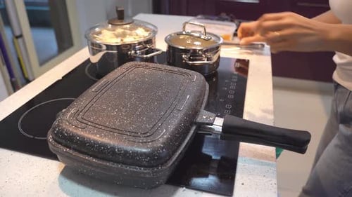 Close Up Woman Cooking Dinner in Kitchen at Home Frying Burger Domestic Candid Lifestyle Routine