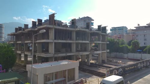 Aerial View MultiStory Building Construction Site With Active Workers and Cranes