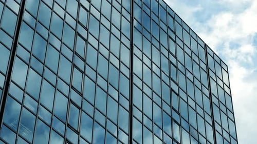 Modern Glass Building Reflecting Sky
