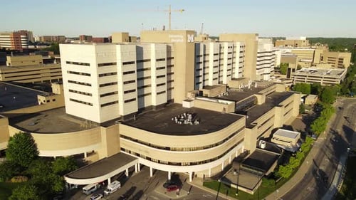 Modern building of Michigan University hospital, aerial fly toward view