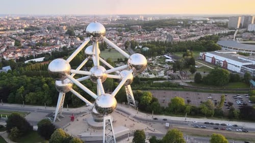 Aerial view of Atomium in Bruxelles at sunset. In the background you can see surrounding buildings a