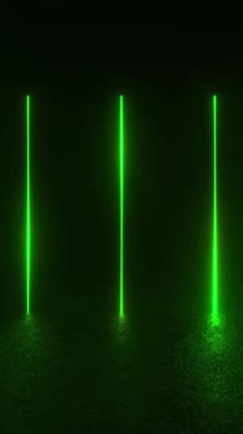 Experience a mesmerizing display of green neon lights glowing on a concrete floor in a dark room.