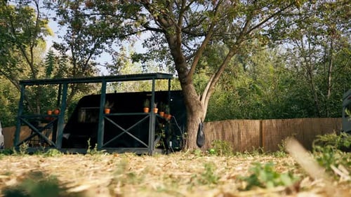 A mobile home with a terrace is located in country glamping site for relaxation and solitude nature
