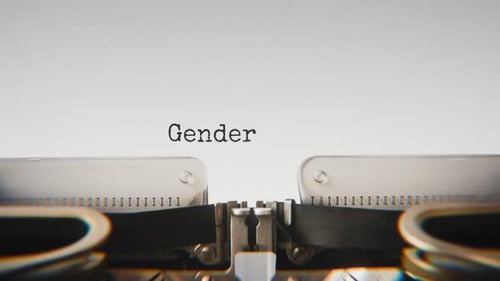 Old mechanical typewriter typing Gender Equality in a close-up view.