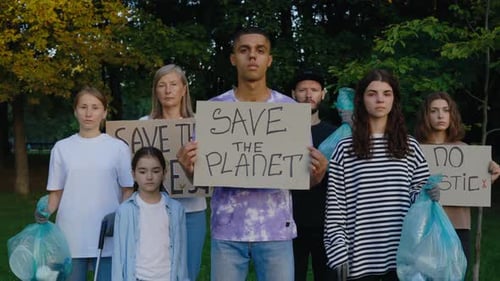 Group of Multiethnic Ecology Volunteers Holding Banners Save Our Planet No Plastic Save Forest Eco