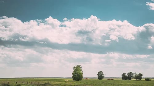 Sky On Horizon Above Rural Landscape Meadow Colorful Cloudy Blue Sky Fluffy Clouds Above Grassland