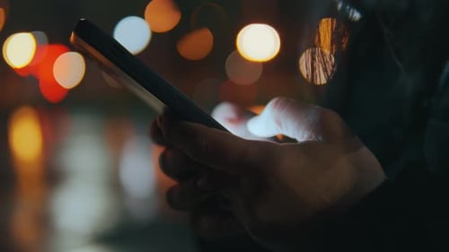 The Phone is in Female Handsfingers are Typing Text Messages on Social Networks