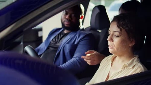 Woman Talking to Passengers in Car