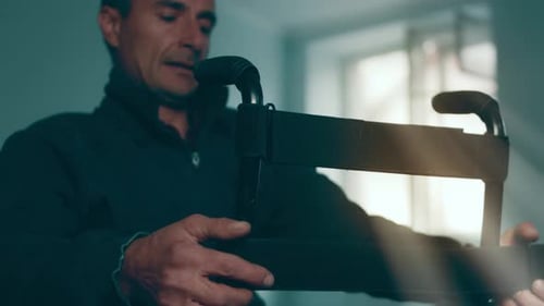 A Disabled Man Assembles a Stroller