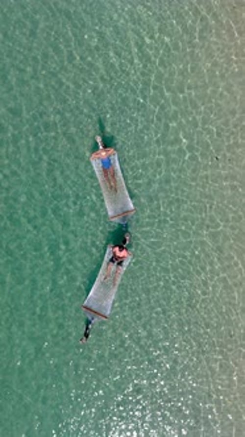 Relaxing in a Hammock Over Clear Waters on Koh Kood Island in Thailand