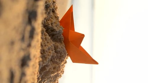 Paper Orange Boat Sand Near Sea Waves Sunny Path on Sandy Beach of Sea Vertical