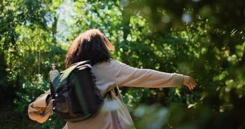 Hiking, backpacking and woman with peace in nature for holiday, adventure or freedom in forest