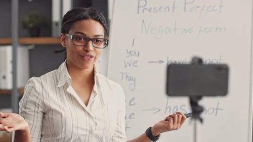 Teacher Explaining Grammar Lesson on Video Call