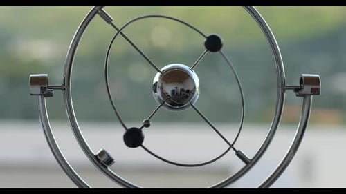 Cropped View Rotating Table Pendulum Balls Anti Stress in the Tropical Nature Background at the