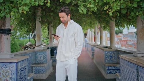 Relaxed Brunette Ending Call Mobile Phone Strolling Alley Man Waiting Alone