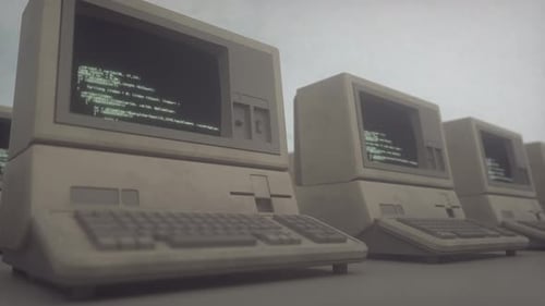 Ordenadores de oficina retro con superficies polvorientas y pantallas de terminales en un bucle perfecto