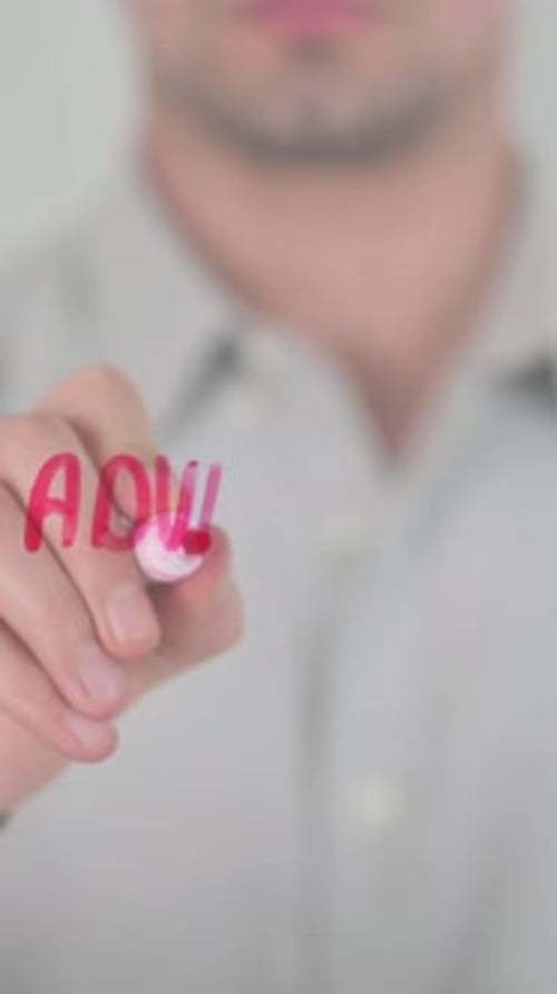 Man Writes "Advertise with Us" on Glass Surface