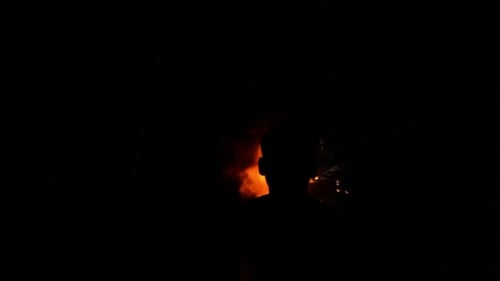 Man Fire Breather Silhouette at Night