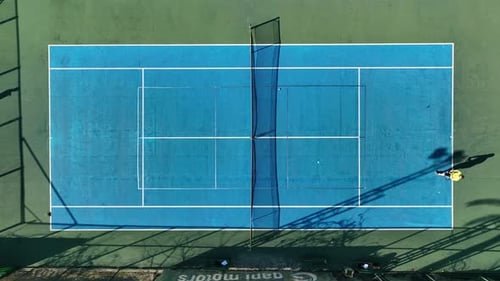 Tennis Players in Action During Game on the Professional Stadium