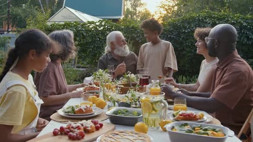 Multi-Generational Family Meal in a Garden Setting