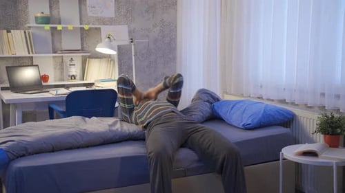 Young man unhappy in his room.
