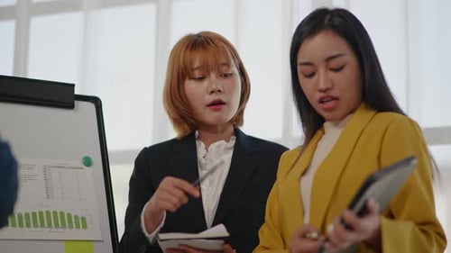 Professional Women Collaborate in Modern Office Setting