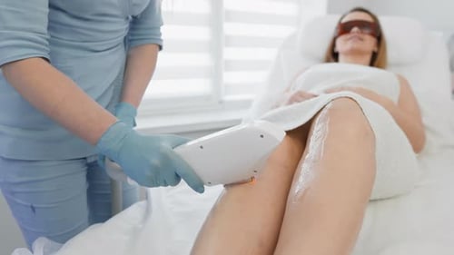Woman Receiving Laser Hair Removal Treatment