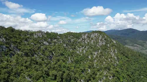 Blue skies and intricate metamorphic rock structures at Baling hill