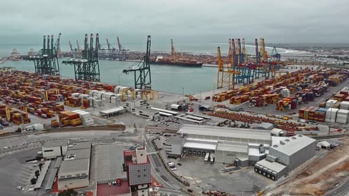 Drone of cargo commercial dock, industrial port with containers and big cranes. Urban logistic marit