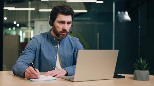 Man Talking on Video Call in Modern Office