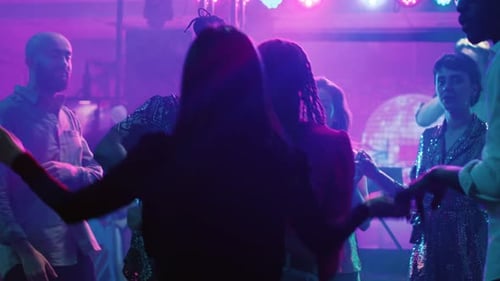Group of Friends Dancing at Night Club Party