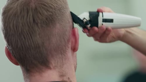 Man Getting a Haircut at Barber Shop