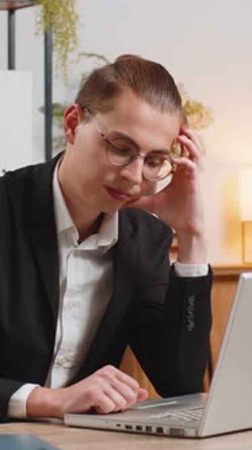 Tired Pensive Caucasian Businessman Thoughtful Taking Break After Laptop Work at Home Office Desk