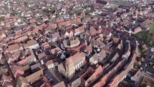 Aerial view of houses and church in Eguisheim, France.