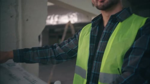 Caucasian Man Architect Holding Draft Plan Builder Handyman Work The Inscription Plan of Arrangement