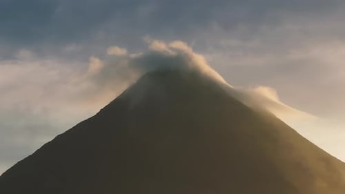 A Stunning Aerial View of a Sunrise Over Arenal Volcano and Laguna