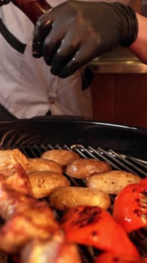 Chef Grilling Meat and Vegetables Indoors