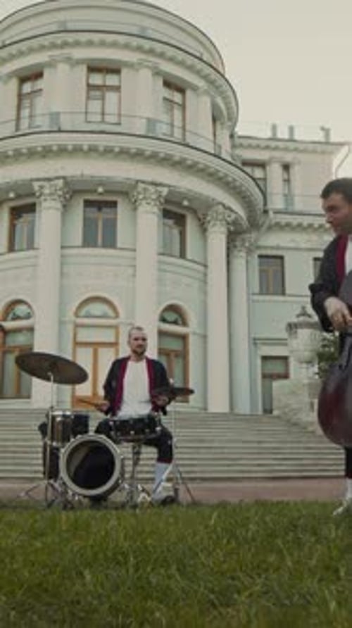 Group of Classical Musicians Playing Together in front of Historical Building