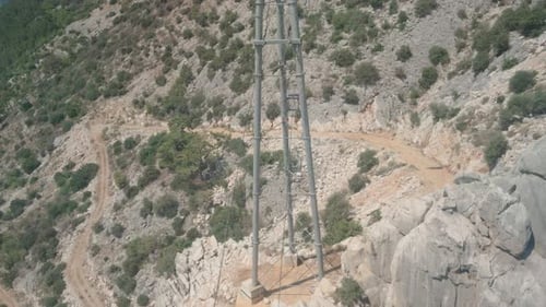 Cable car, funicular. We look down at the mountains and the hiking path.