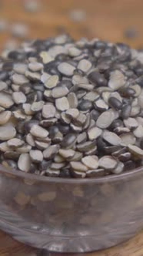 Vertical Video of Black Gram Split (Urad Chilka)