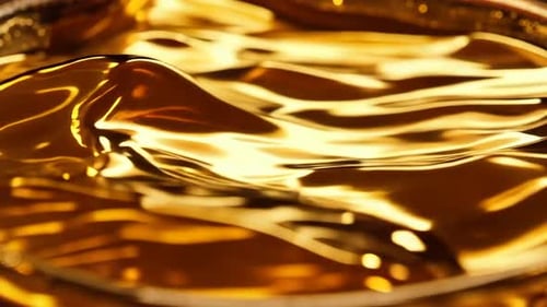 Seamless Abstract Golden Fluid Waves Motion Background
