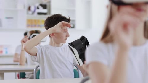 Teenagers Use Virtual Reality Headsets in School Classroom