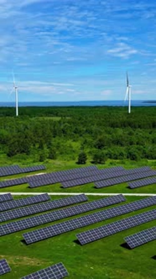 Vertical Views of Solar And Wind Farms Over Rural Landscape. Aerial Shot