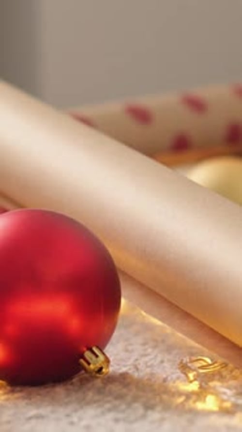 Festive Christmas Ornaments and Wrapping Paper Still Life