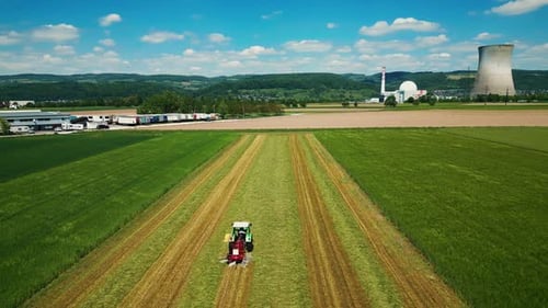 Tractor Working in a Green Field