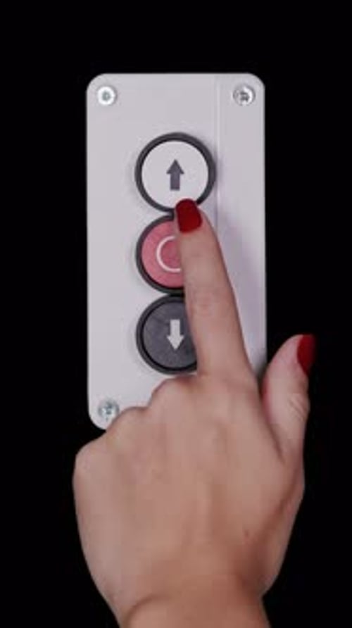 Hand Pressing Up and Down Buttons on Black