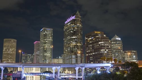 Tampa Florida at Night Highway Bridge Transportation Near Brightly Illuminated High Skyscraper