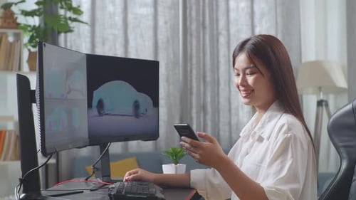 Side View Of Asian Female Automotive Designer Comparing The 3D Model Of Ev Car On The Computer